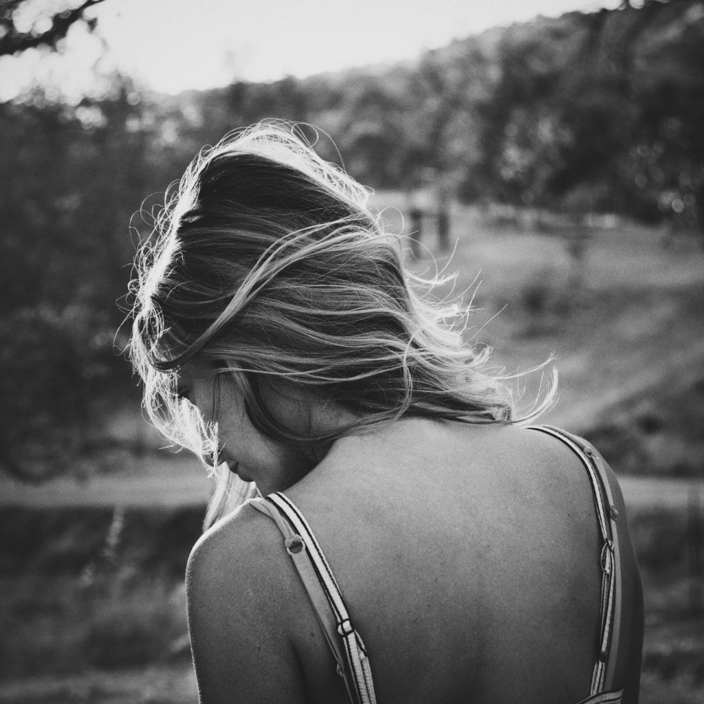 women in black and white looking down